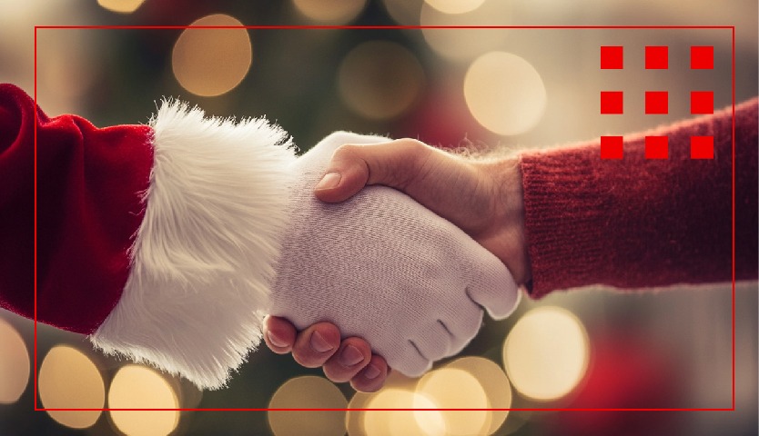 Estrechamiento de manos, entre Papa Noel y una persona