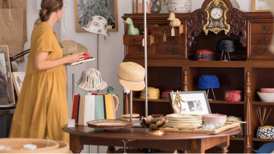 Woman in a hat shop